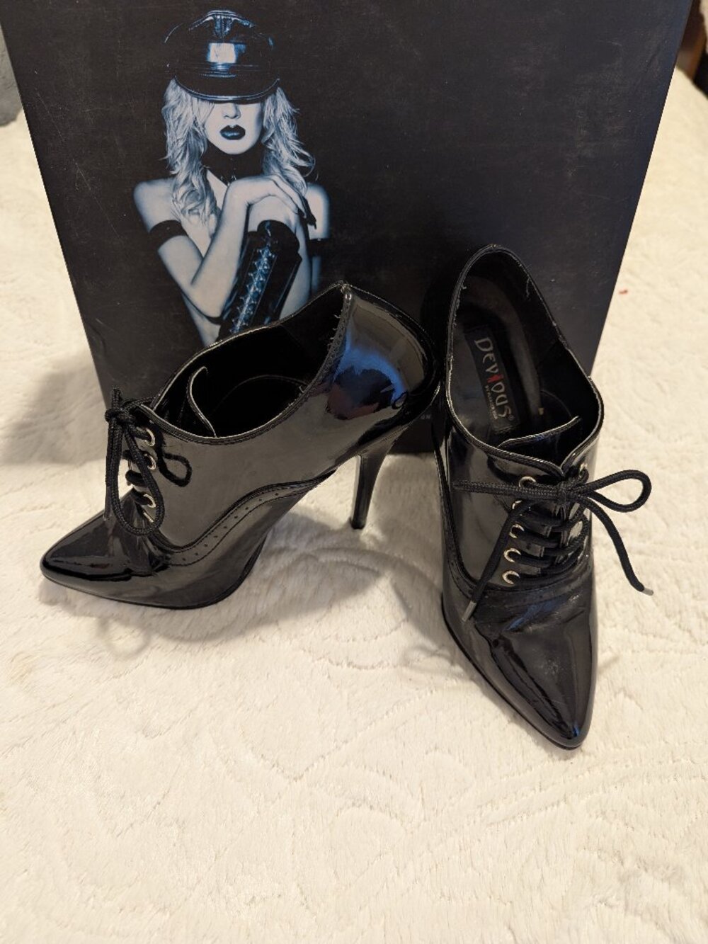 Devious black patent stiletto boots